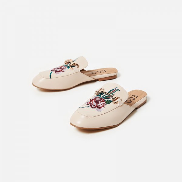 Cheska Floral Embroidered Flat Mule In Nude Faux Leather